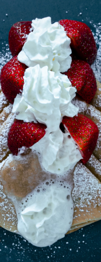 Crepes with strawberries and whipped cream
